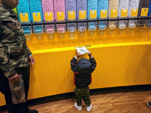 Baby grabbing bag at M&M World in Las Vegas