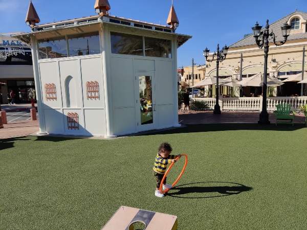 toddler playing with hula hoop Towne Square Park Las Vegas